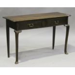 A 20th century oak side table, fitted with two frieze drawers, raised on cabriole legs and shaped