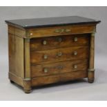 A French Empire mahogany commode with gilt metal mounts, the black marble top above four long