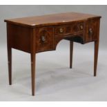 An early 20th century George III style serpentine fronted mahogany sideboard with inlaid decoration,