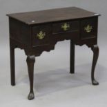 A Queen Anne and later oak lowboy, fitted with three frieze drawers, on cabriole legs and pointed