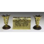 A late Victorian cast brass dome-topped stationery box, the pierced foliate body enclosing a