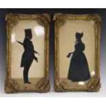 A pair of Victorian cut-paper full-length silhouettes, depicting Benjamin and Catherine Smith,