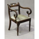 A George IV mahogany scroll arm elbow chair, on ring turned legs, height 80cm, width 56cm.Buyer’s