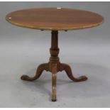 A 19th century walnut circular tip-top wine table, raised on a turned column and tripod cabriole