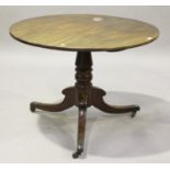 A late George III mahogany circular tip-top supper table, on a turned column and tripod sabre