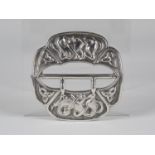 An Edwardian Arts and Crafts 'Iona' silver buckle of shaped form, worked with Celtic knots and