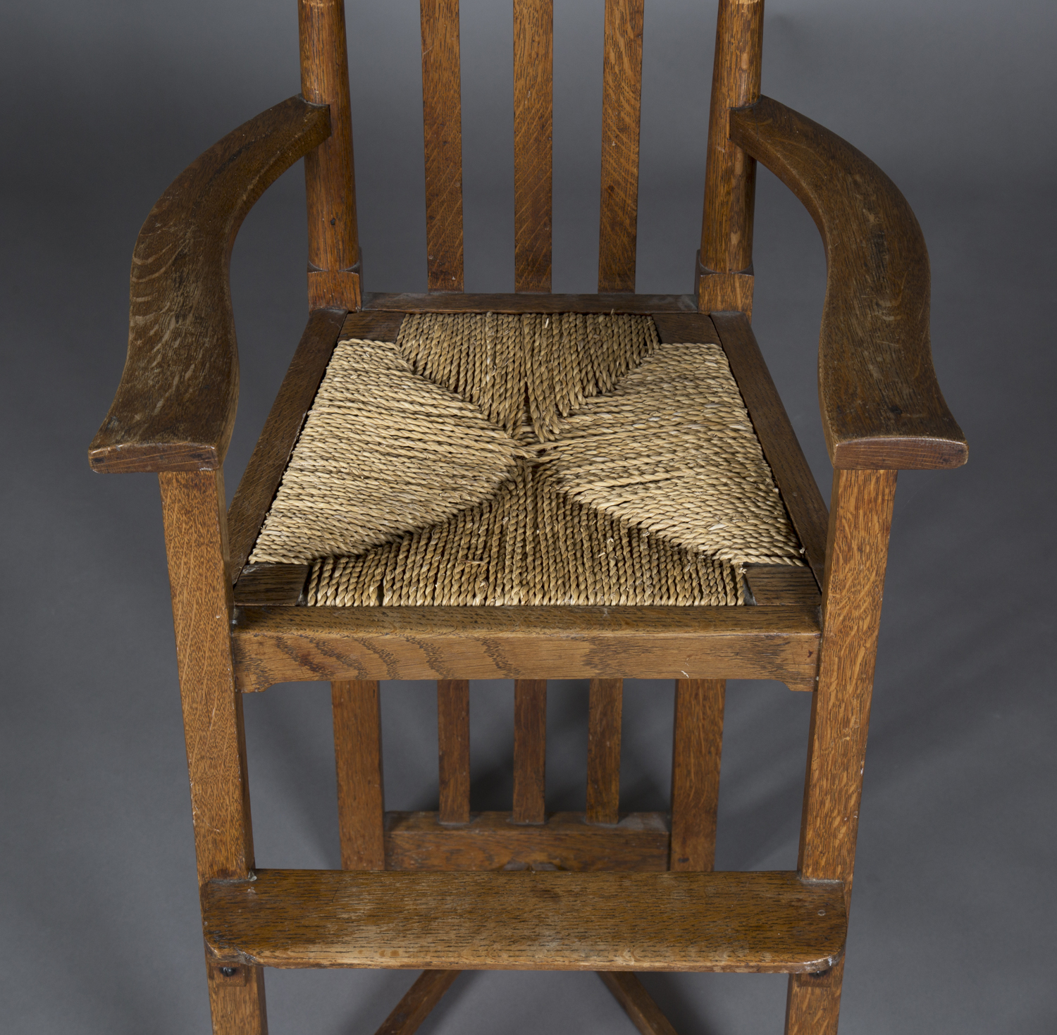 A late 19th/early 20th century Arts and Crafts oak framed child's high chair, in the manner of - Image 3 of 3