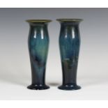 A pair of Ashby Guild stoneware vases, 1909-22, the swollen cylindrical bodies with everted rims and