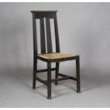 An Edwardian Arts and Crafts ebonized oak side chair by Liberty & Co, the double splat back above
