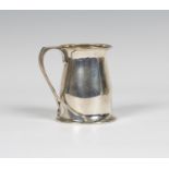 An early 20th century Arts and Crafts silver tankard, after a design by Oliver Baker for Liberty &