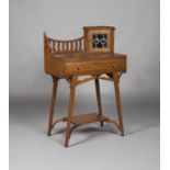 An Edwardian Arts and Crafts stained ash writing table, in the manner of Liberty & Co, the gallery