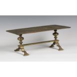 A cast brass rectangular footman, formed from a fireplace panel designed by Thomas Jeckyll, the