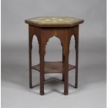 A late Victorian Moorish style mahogany octagonal two-tier occasional table, attributed to Liberty &
