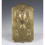 A late 19th/early 20th century Arts and Crafts brass wall sconce backplate, the shaped panel