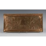 An Edwardian Arts and Crafts copper rectangular tray, dated '1907' and worked with stylized plant