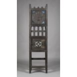 An early 20th century American Arts and Crafts stained oak longcase clock by Sessions Clock Co, with