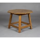 An early 20th century Arts and Crafts Cotswold School oak octagonal occasional table, the deeply