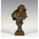 An Art Nouveau patinated cast spelter bust of a young lady, titled 'Evangeline', the stem cast as