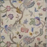 An early 20th century Arts and Crafts crewel work style embroidered panel, worked in coloured