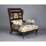 A late Victorian Aesthetic Movement rosewood framed armchair, the panelled back with spindle