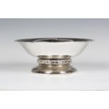 A George V Liberty & Co 'Cymric' silver bowl, model number '50221', the hammered circular body
