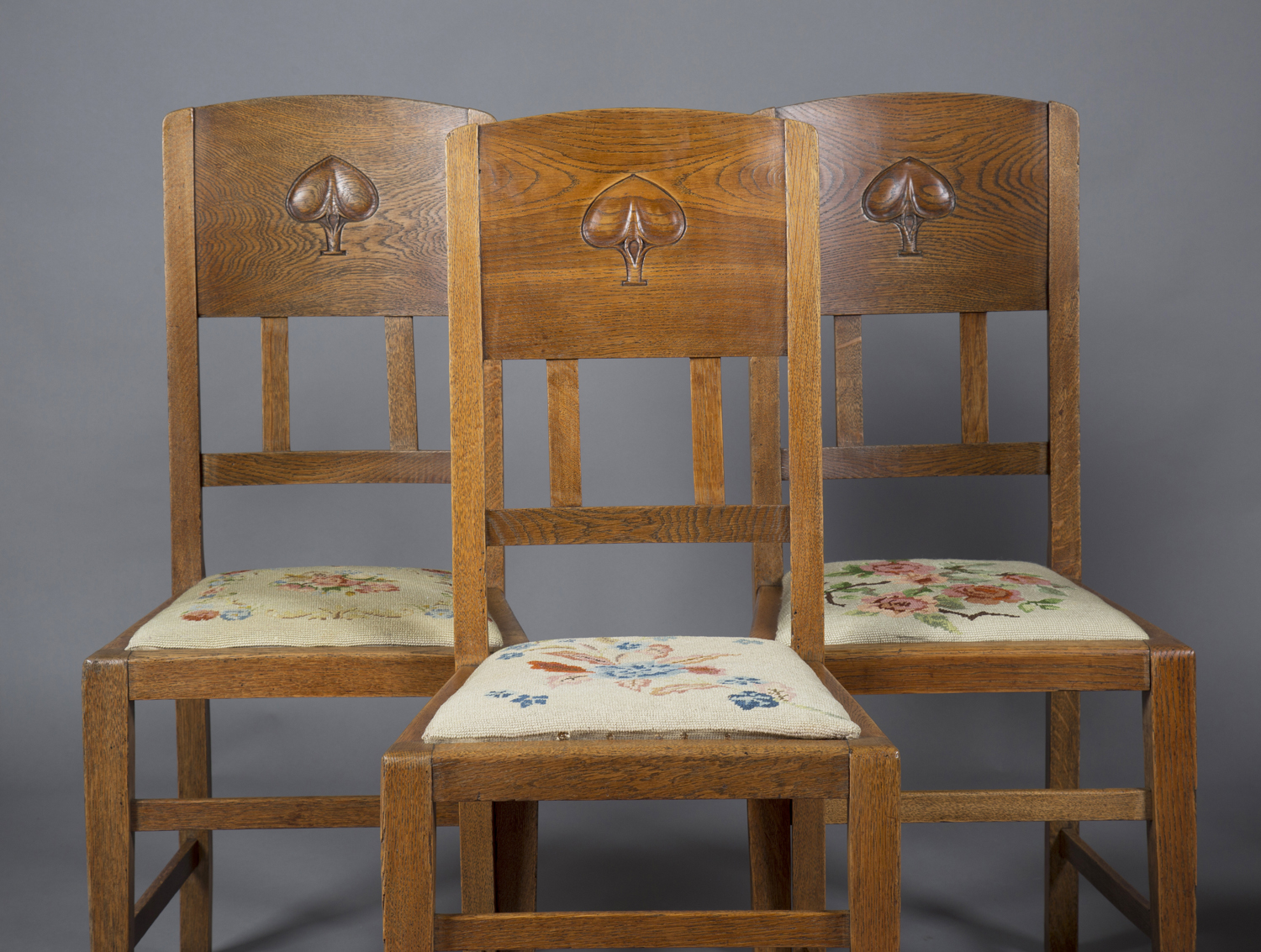 A set of four Edwardian Arts and Crafts oak framed and ash backed dining chairs, designed by W.J. - Image 2 of 2