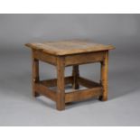 An Arts and Crafts oak square low table by Russell & Sons, Broadway, Worcestershire, probably