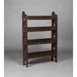 An Edwardian Arts and Crafts stained oak four-tier 'Sedley' bookcase by Liberty & Co, the pegged