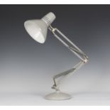 A mid-20th century Swedish grey enamelled anglepoise lamp, raised on a circular base, height 80cm.