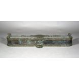 A late 19th century patinated bronze fender of shaped form and riveted construction, height 16cm,