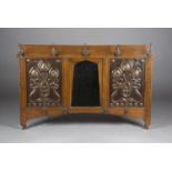 An Edwardian Arts and Crafts oak framed hall mirror by Shapland & Petter of Barnstaple, the