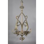 A late Victorian brass four-branch ceiling light, in the manner of W.A.S. Benson, the central stem