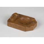 A Robert 'Mouseman' Thompson oak ashtray, the top carved with typical mouse signature, length 10.