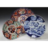 A Japanese Imari porcelain lobed charger, Meiji period, painted with a central flower basket