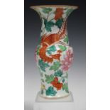 A Chinese famille rose porcelain vase, late 19th century, the baluster body painted in iron red with