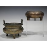 A Chinese bronze tripod censer, 20th century, the squat circular body engraved with birds, flowers