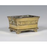 A Chinese polished bronze censer, mark of Xuande but Qing dynasty, of flated rectangular form,