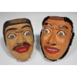 Two South-east Asian painted and carved wooden masks, early 20th century, probably Balinese, with