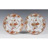 A pair of Chinese export porcelain circular dishes, Qianlong period, each painted in iron red,