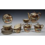 A Japanese Satsuma earthenware part tea service, 20th century, each piece polychrome painted and