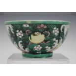 A Chinese famille verte enamelled and blue and white biscuit porcelain bowl, Kangxi period, the