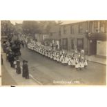 Four albums containing approximately 1000 postcards of Sussex, including photographic postcards