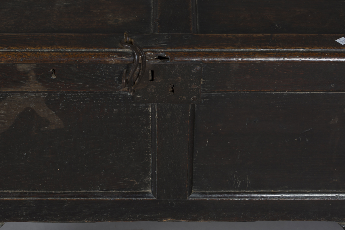 An early 18th century oak panelled coffer, the hinged lid with wrought iron latch, raised on long - Image 4 of 5