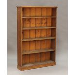 A late Victorian oak and pine open fronted bookcase, fitted with four fixed shelves, height 158cm,