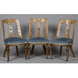 A set of three late Victorian Aesthetic Movement walnut bar and splat back dining chairs, height