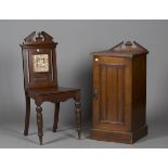 A late Victorian walnut framed hall chair, the back inset with a transfer printed ceramic tile,