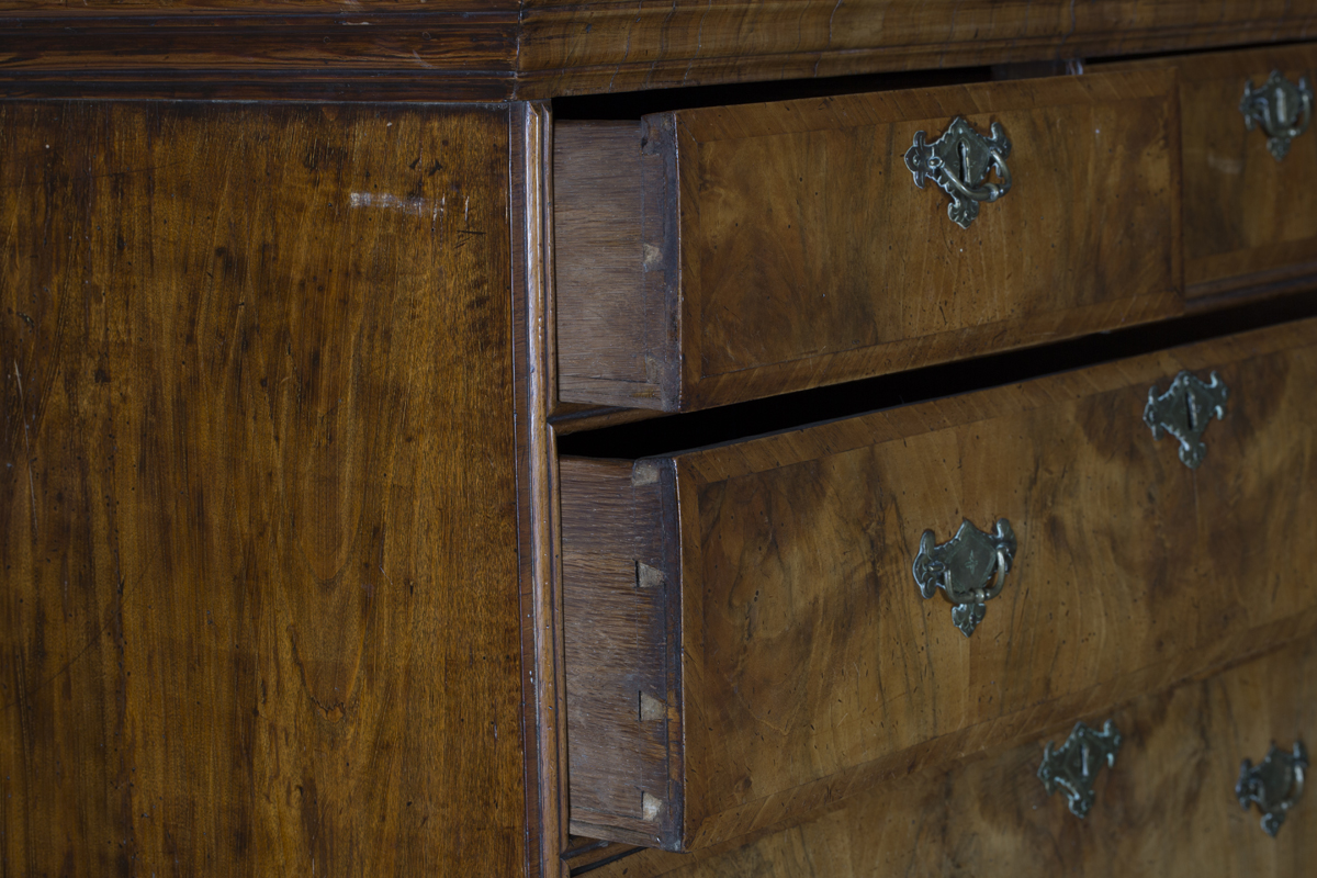 A George I walnut chest-on-stand, the moulded pediment above two short and three long oak-lined - Image 2 of 5