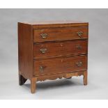 A small George IV mahogany chest of three long drawers with satinwood crossbanded borders and an