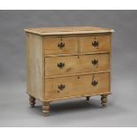 A late Victorian pine chest of two short and two long drawers, on turned legs, height 85cm, width