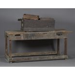 A mid-20th century pine work bench, the front with cast iron vice, height 81cm, width 181cm, depth